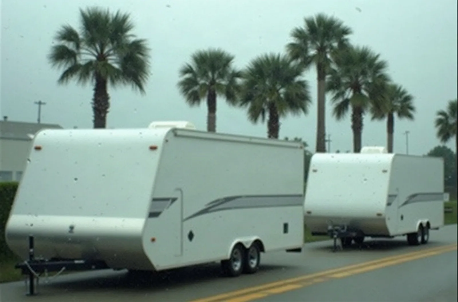 Florida storm seen through a rainy window, the humidity that pushes owners toward climate controlled RV storage